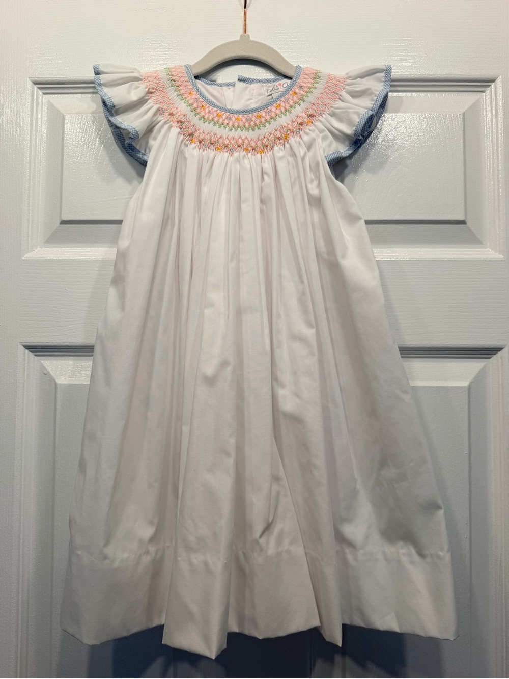 Petit Ami White Dress with Pink, Blue & Yellow Smocking